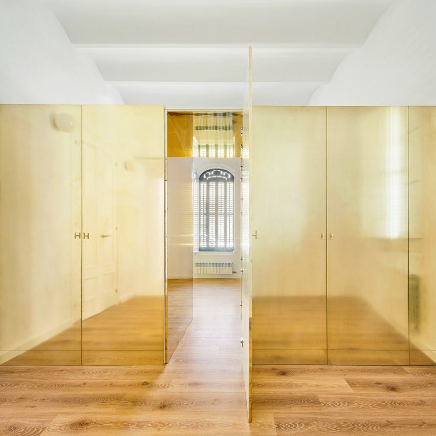 The Magic Box Apartment by Raúl Sánchez Architects features gold wardrobe