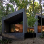 Weber Arquitectos builds San Simon Cabins from volcanic rock