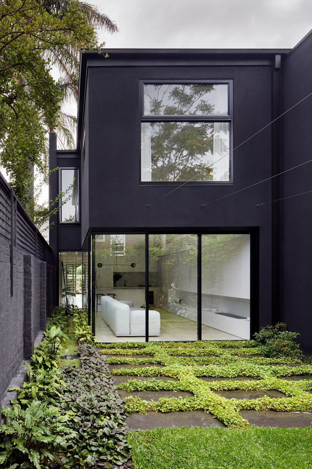 Black Facade Of Melbourne Townhouse Contrasts Its White Interiors