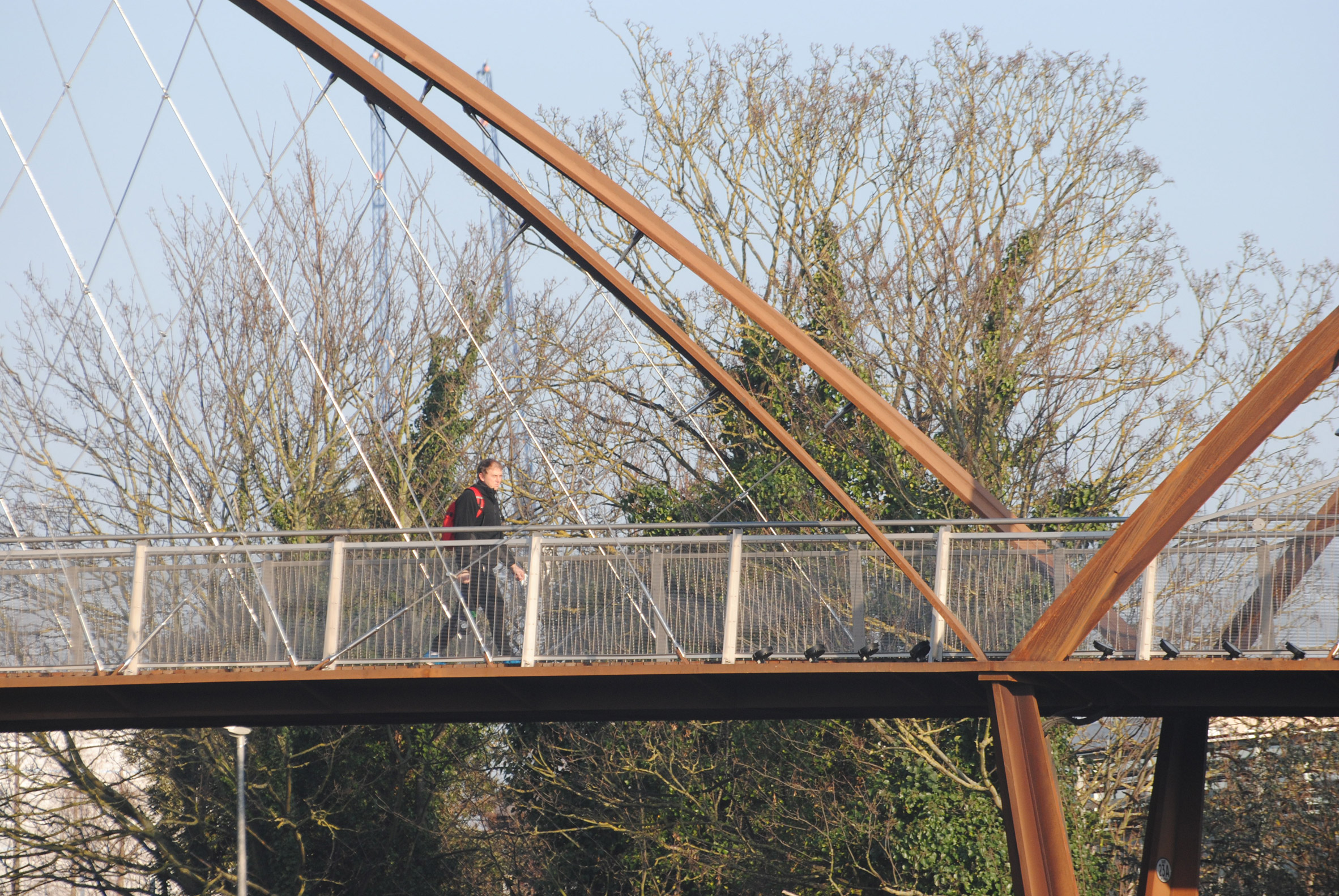 Useful Studio creates arched weathering steel Chiswick Park Footbridge