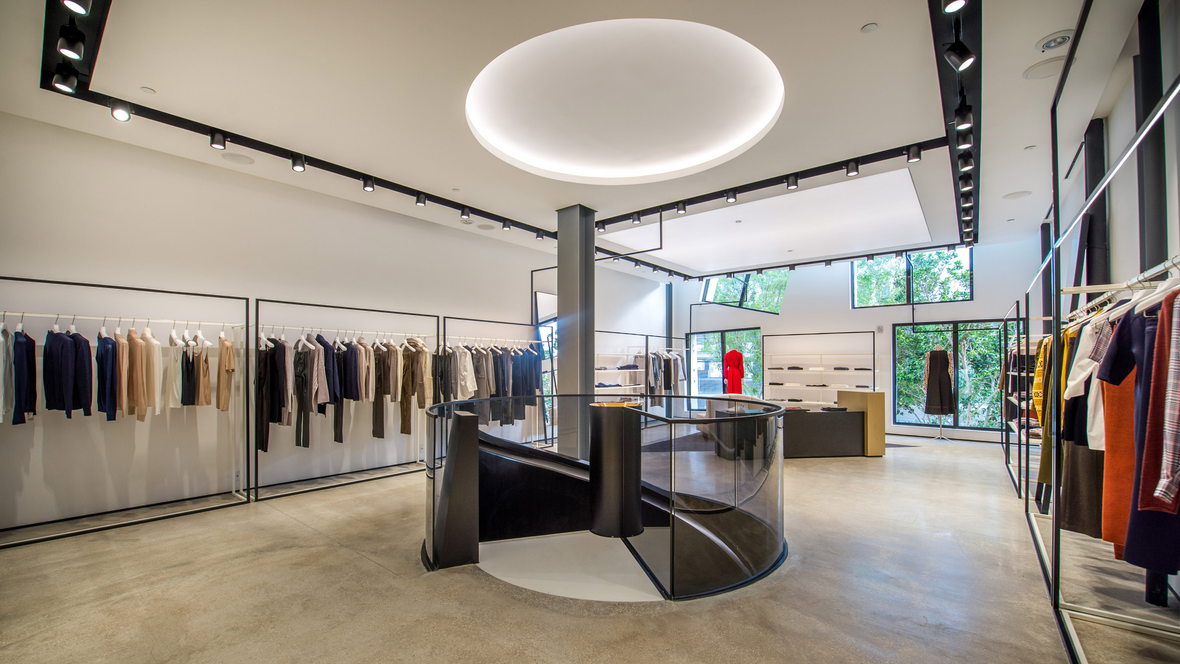 Black spiral staircase twists through Joseph store in Miami Design District