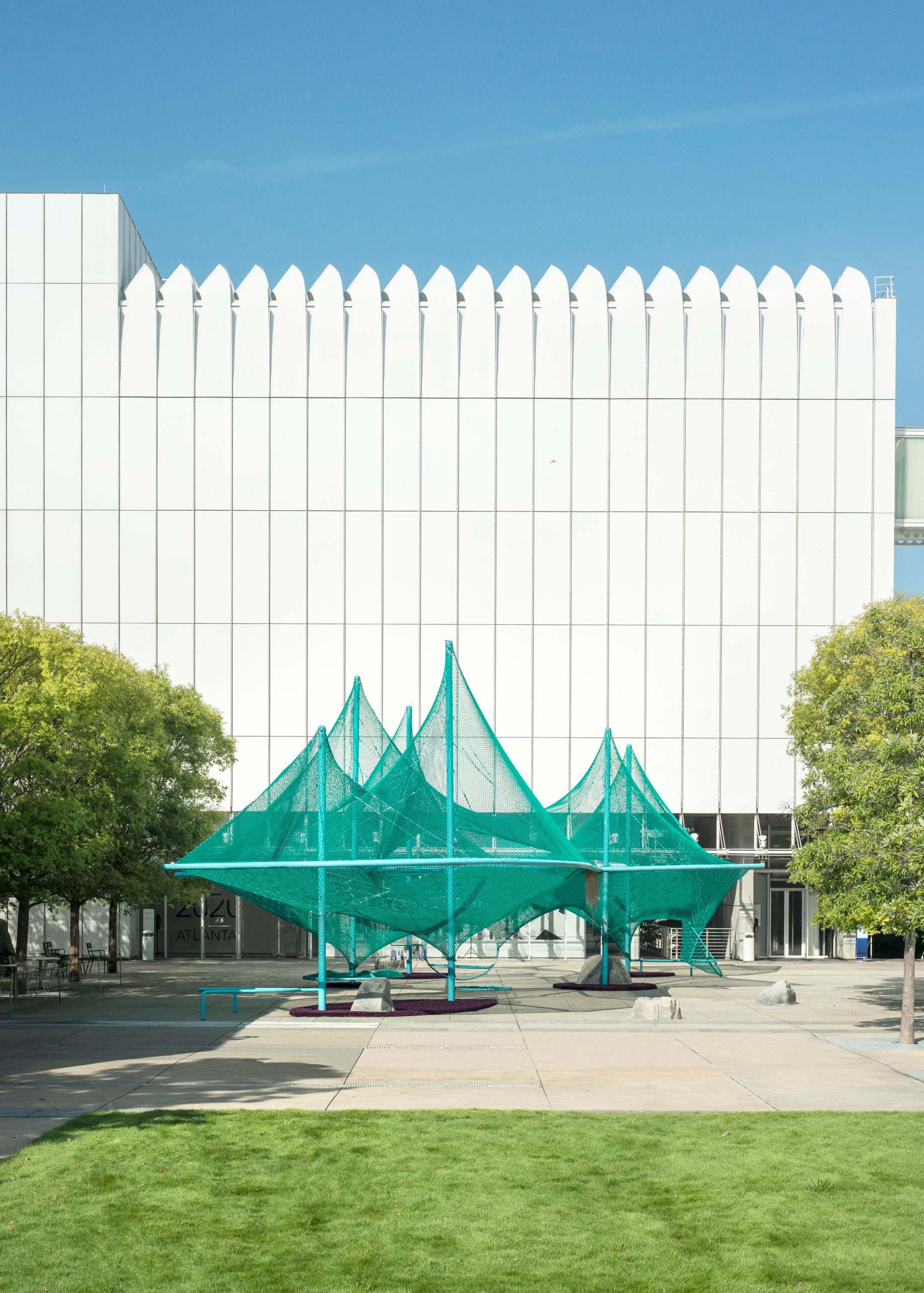 A green installation formed by the structure of trees