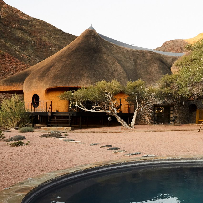 The Nest at Sossus guesthouse in Namibia features a thatched facade