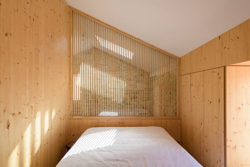 Bedroom with wooden walls
