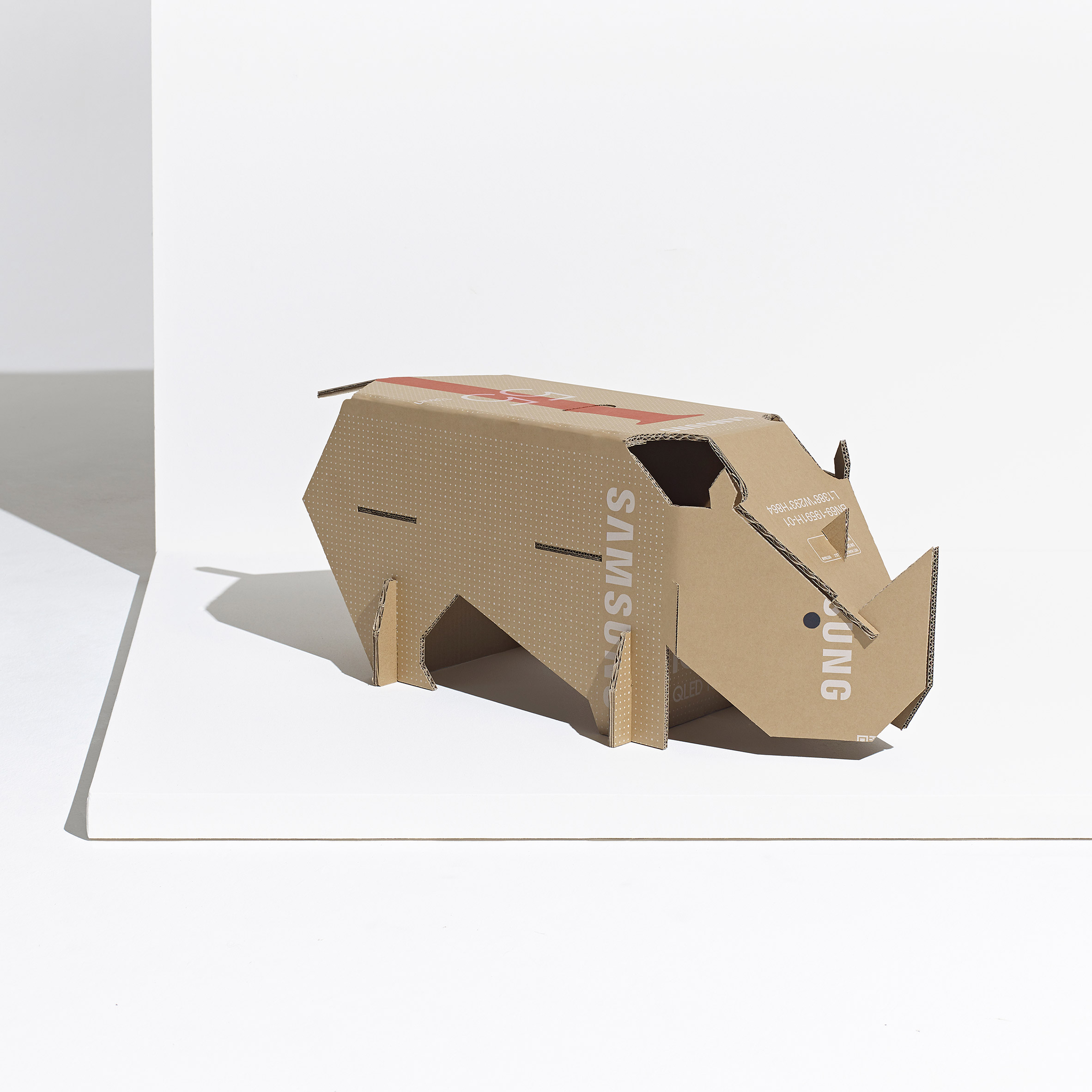 Black rhino toy made from repurposed Samsung TV cardboard boxes