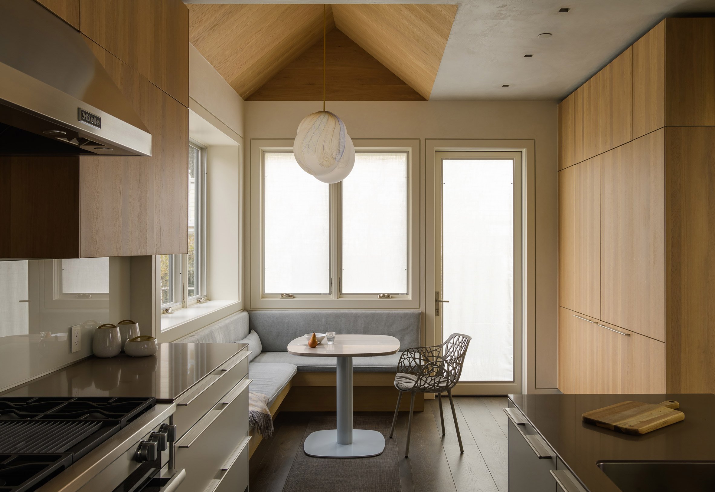Kitchen and dining area of Music Box by CCY Architects