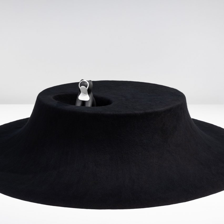 Asif Khan designs black felt table with nook for dogs to snuggle up inside