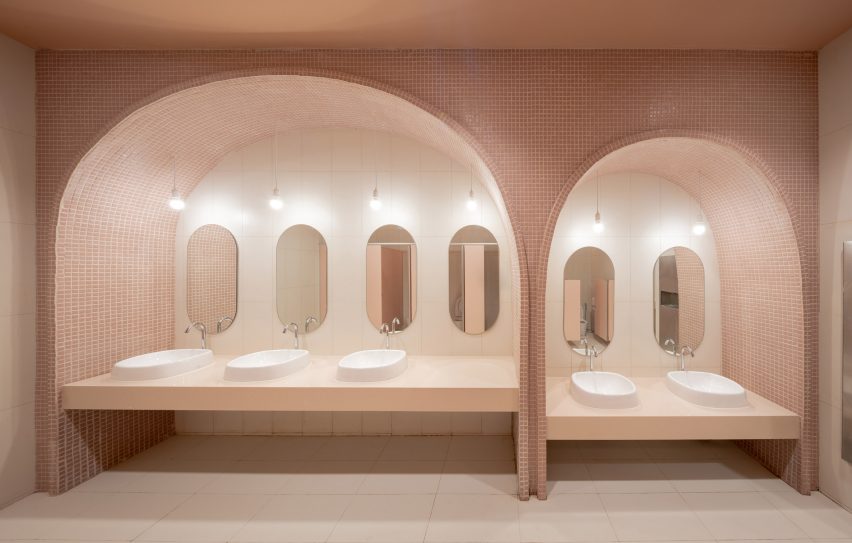 Arched pink tiled bathroom in children's hospital designed by Integrated Field