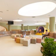 pharmacy with soft play area in children's hospital by Integrated Field