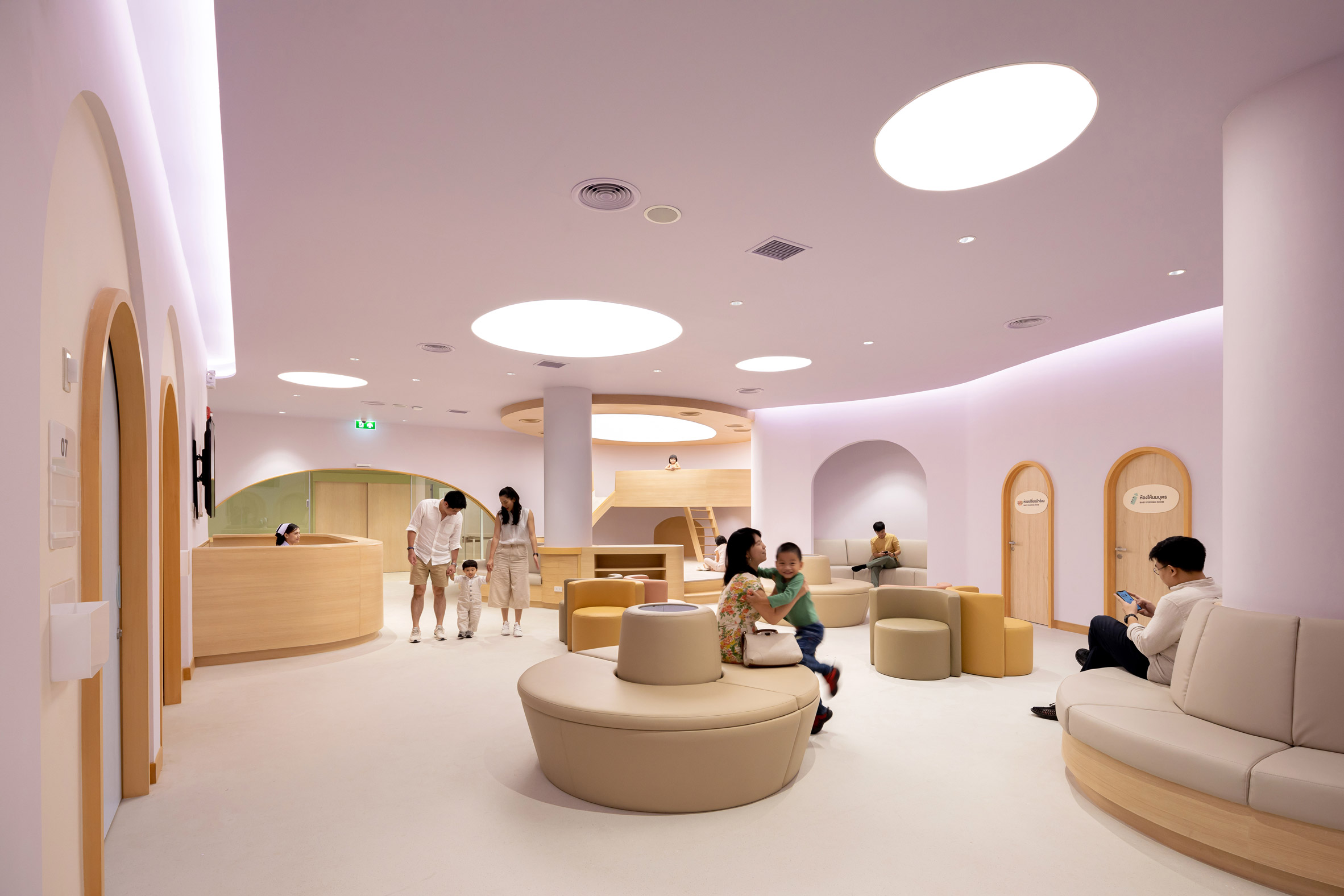 Pink waiting room in children's hospital designed by Integrated Field