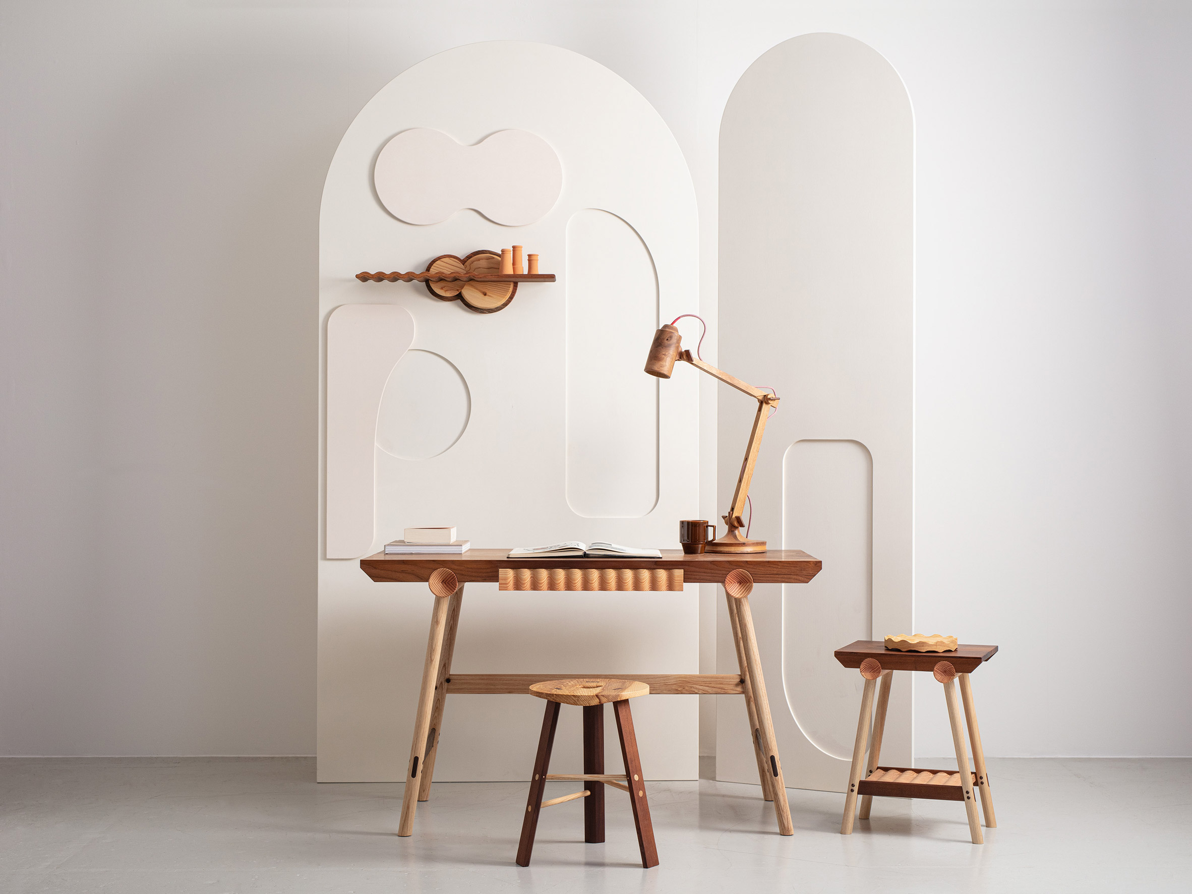 The desk, stool, sidetable and shelf from Jan Hendzel Studio's Bowater collection made using British hardwood