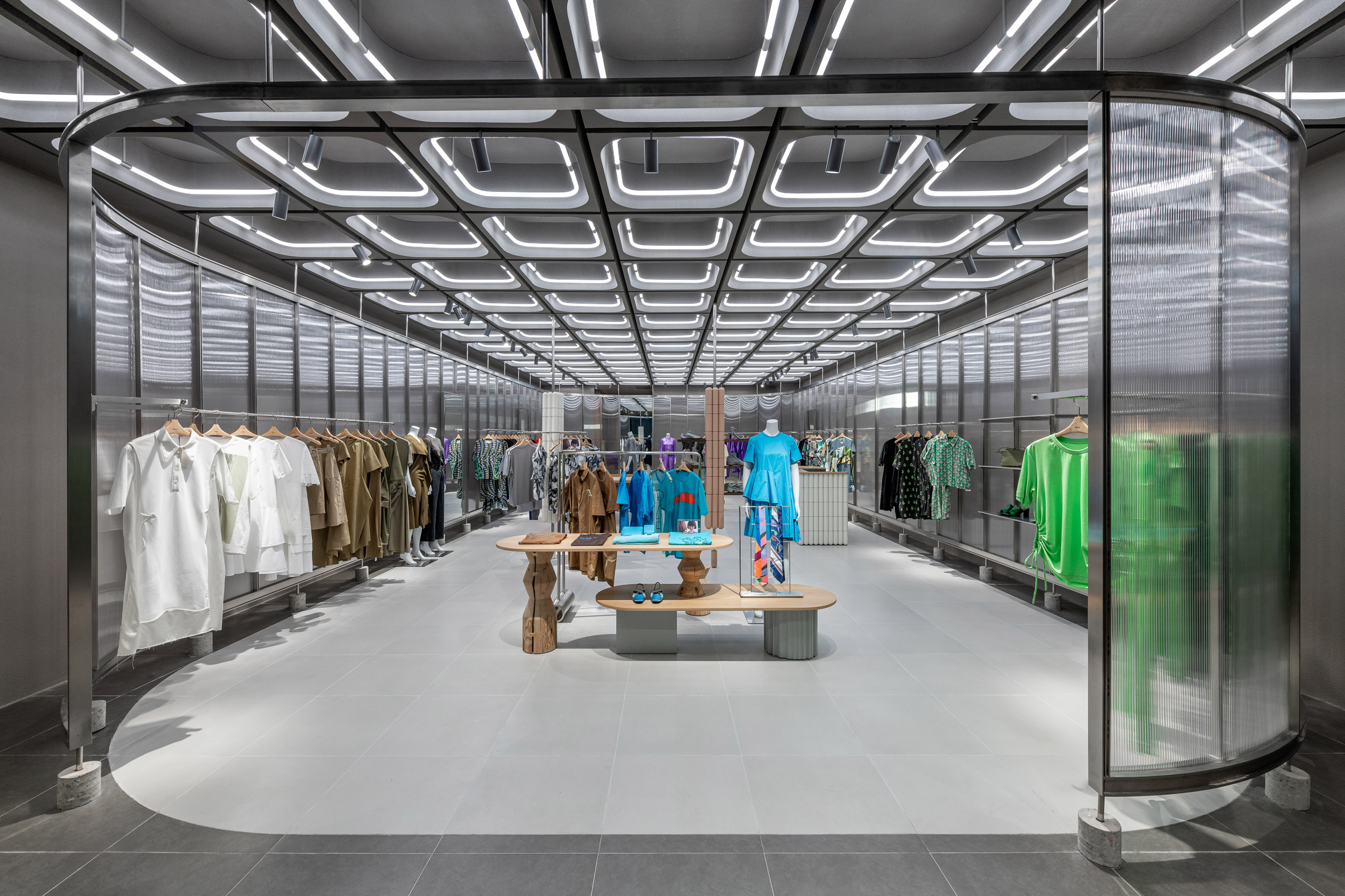Interiors of JNBY store in Xiamen, China feature concrete, steel and glass