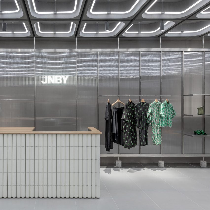 Interiors of JNBY store in Xiamen, China feature concrete, steel and glass