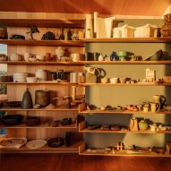 Shelf of ceramics in Kew Residence by John Wardle Architects in Melbourne, Australia