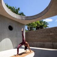Circular opening illuminates patio for yoga in coastal Mexican holiday house