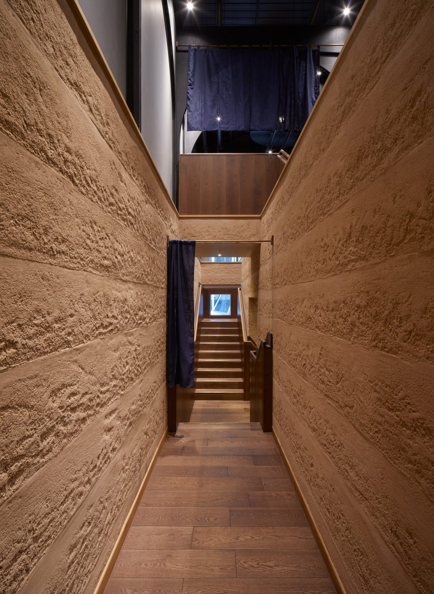 Corridor with Rammed Earth Finishes clay plaster walls by Clayworks