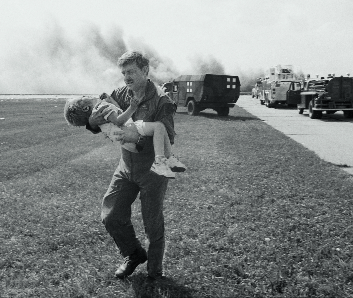 Spencer Bailey being carried after the 1989 crash-landing of United Flight 232 in Sioux City, Iowa, USA