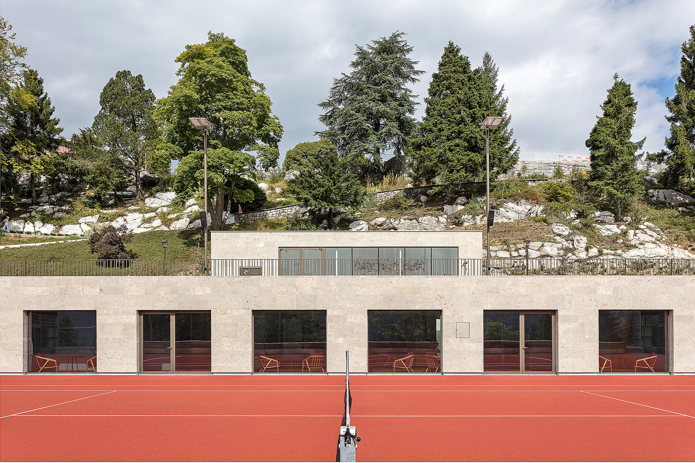Club house of Diamond Domes tennis courts designed by Rüssli Architekten with CLT roofs by Neue Holzbau in the Swiss Alps