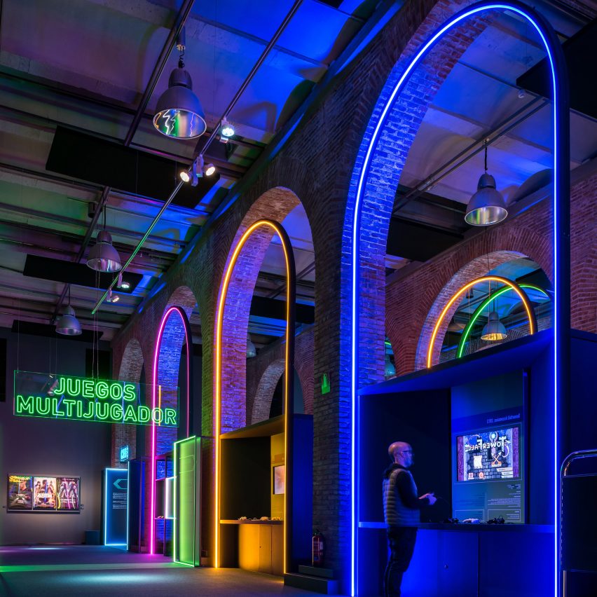 Game On's neon-filled exhibition design pays homage to 80s video games