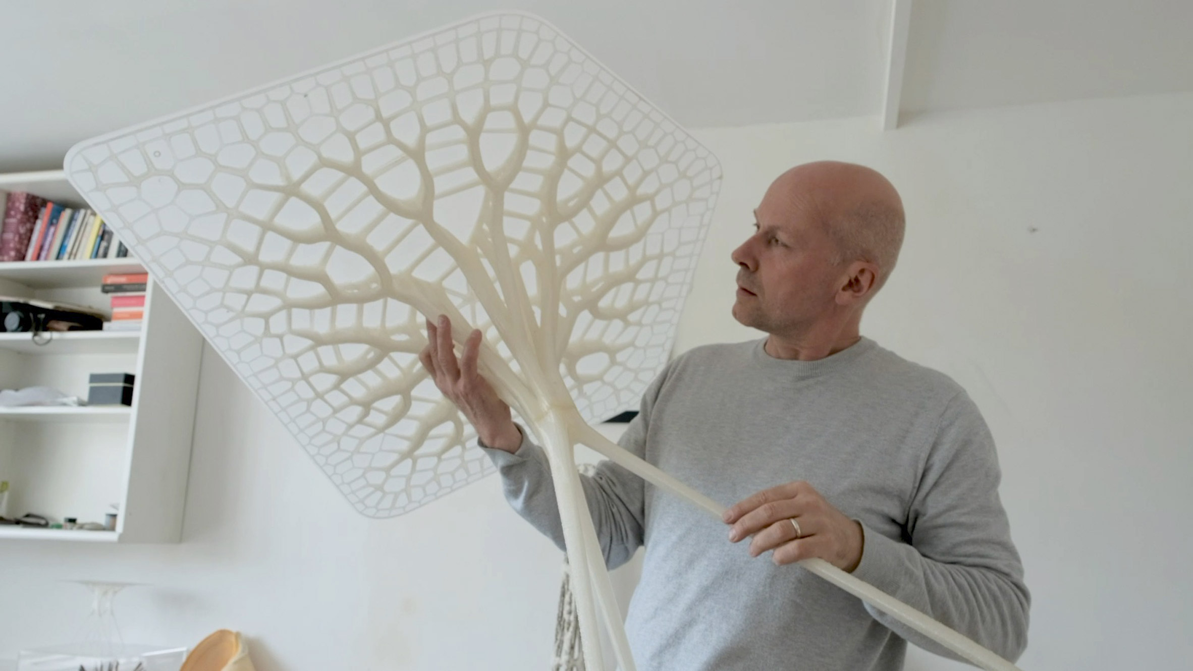 Michael Pawlyn of Exploration Architecture holding Designing With Nature tables