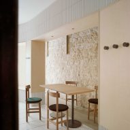Exposed limestone walls feature inside Papi restaurant in Paris