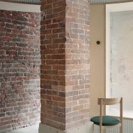 Exposed brick walls feature inside Papi restaurant in Paris