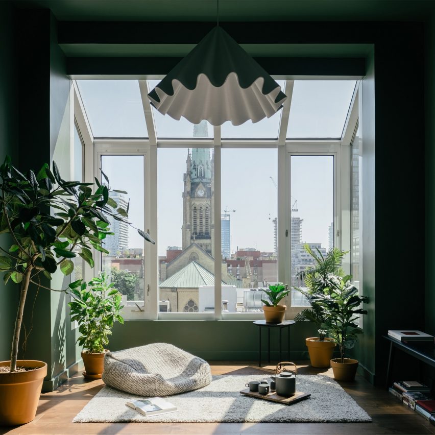 Green-painted sunroom with cathedral views features in renovated Toronto apartment