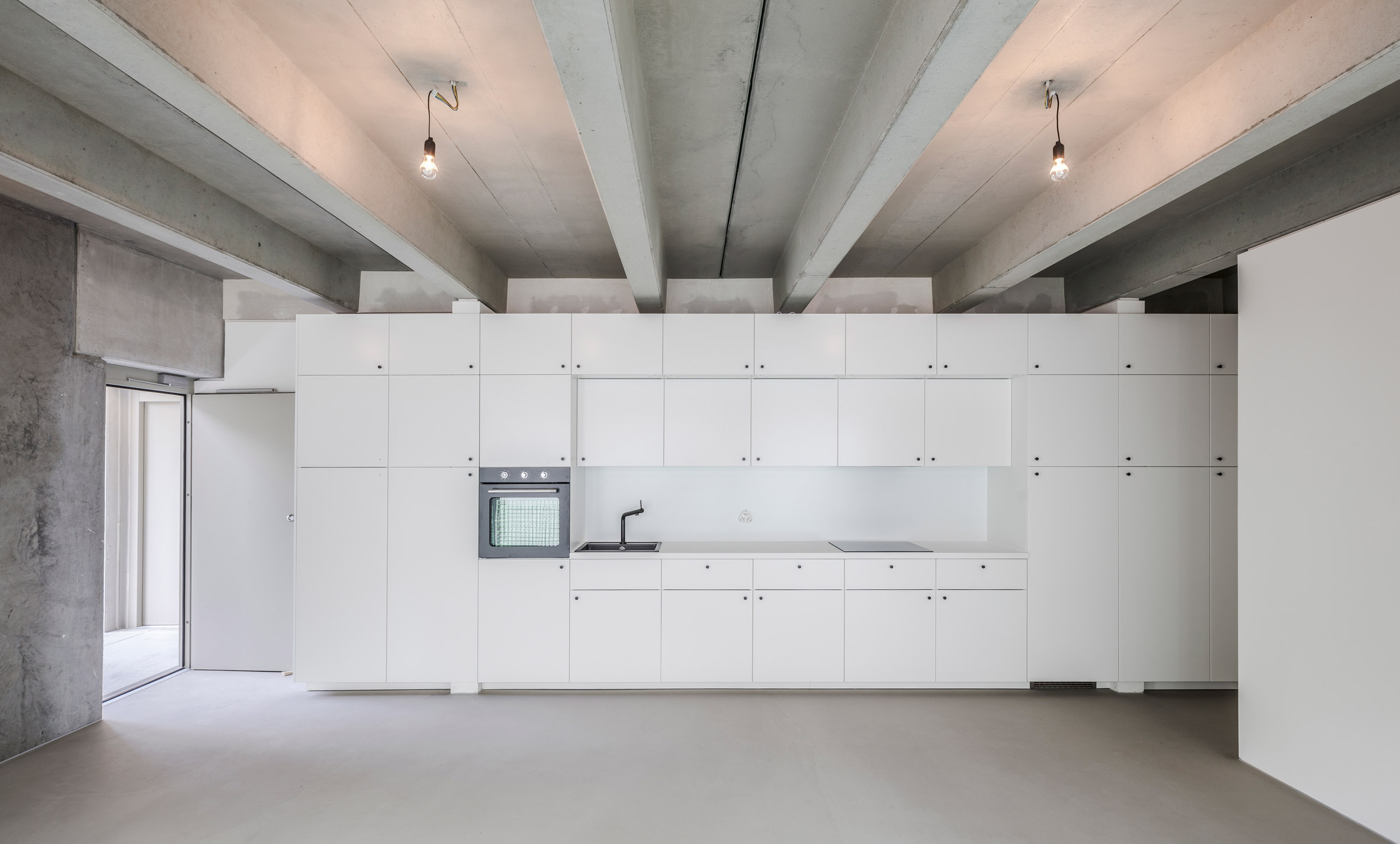 Kitchen in Wohnregal, a prefabricated concrete housing block by FAR in Berlin, Germany