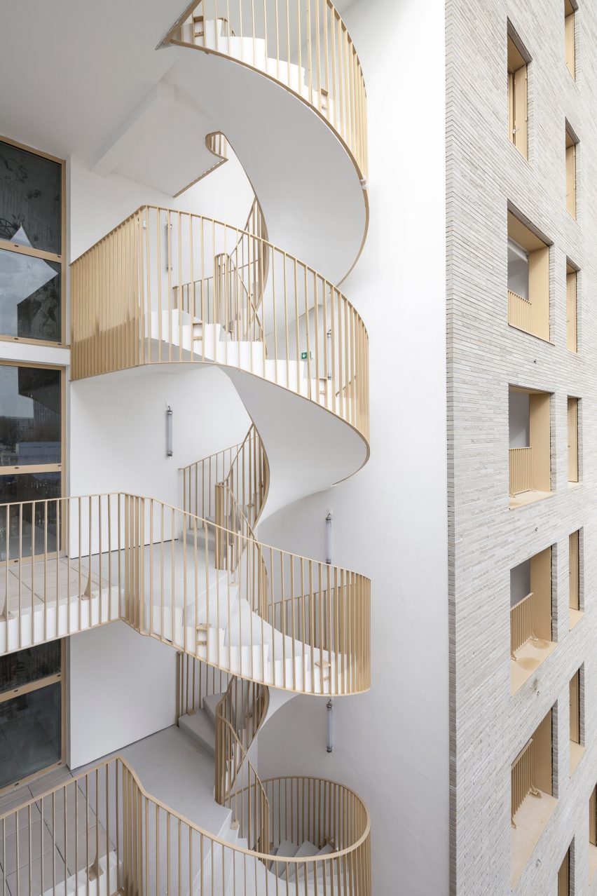 Spiral staircase of Zellige housing in Nantes, France, by Tectône and Tact Architectes