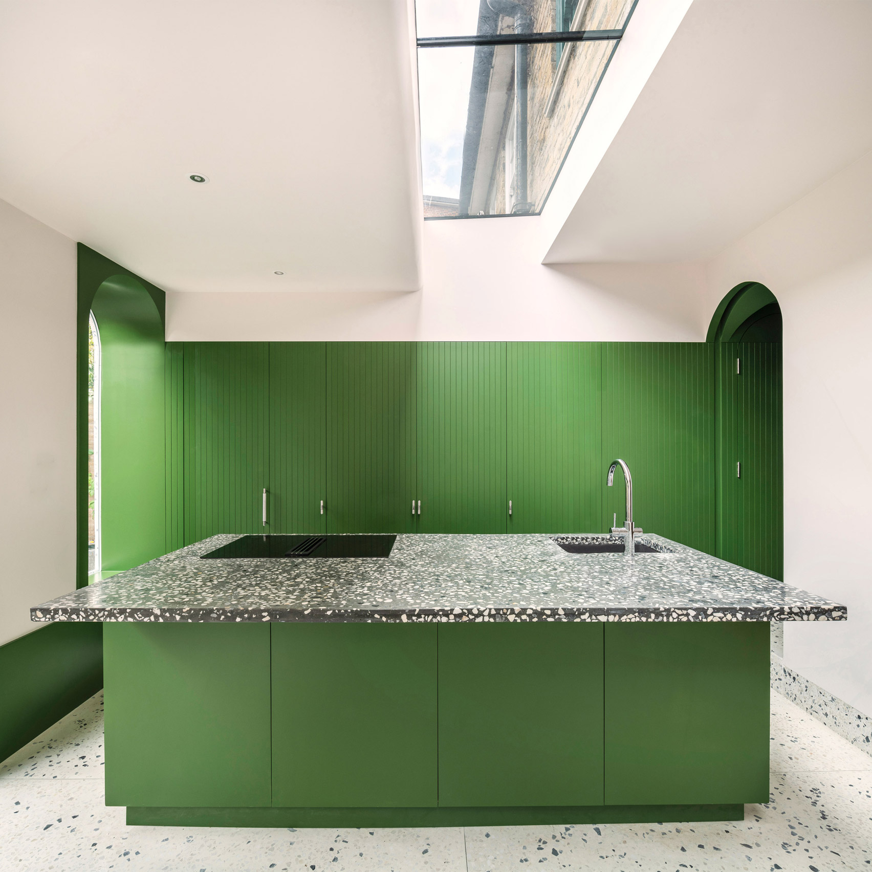 Bright green kitchen with terrazzo detailing