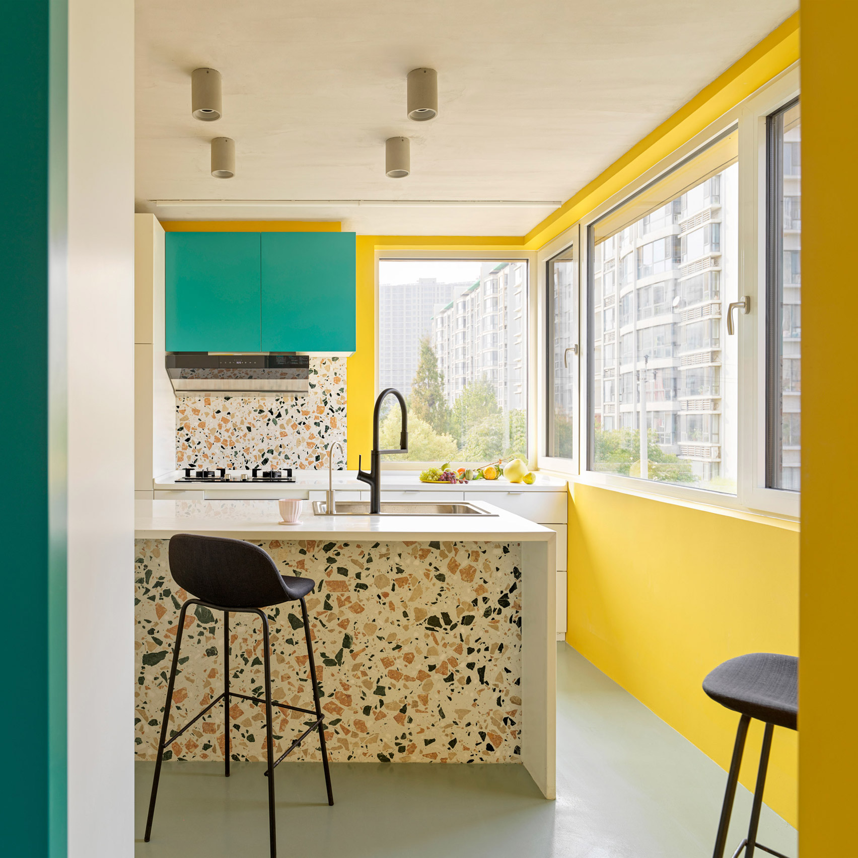 Bright yellow and turquoise kitchen 