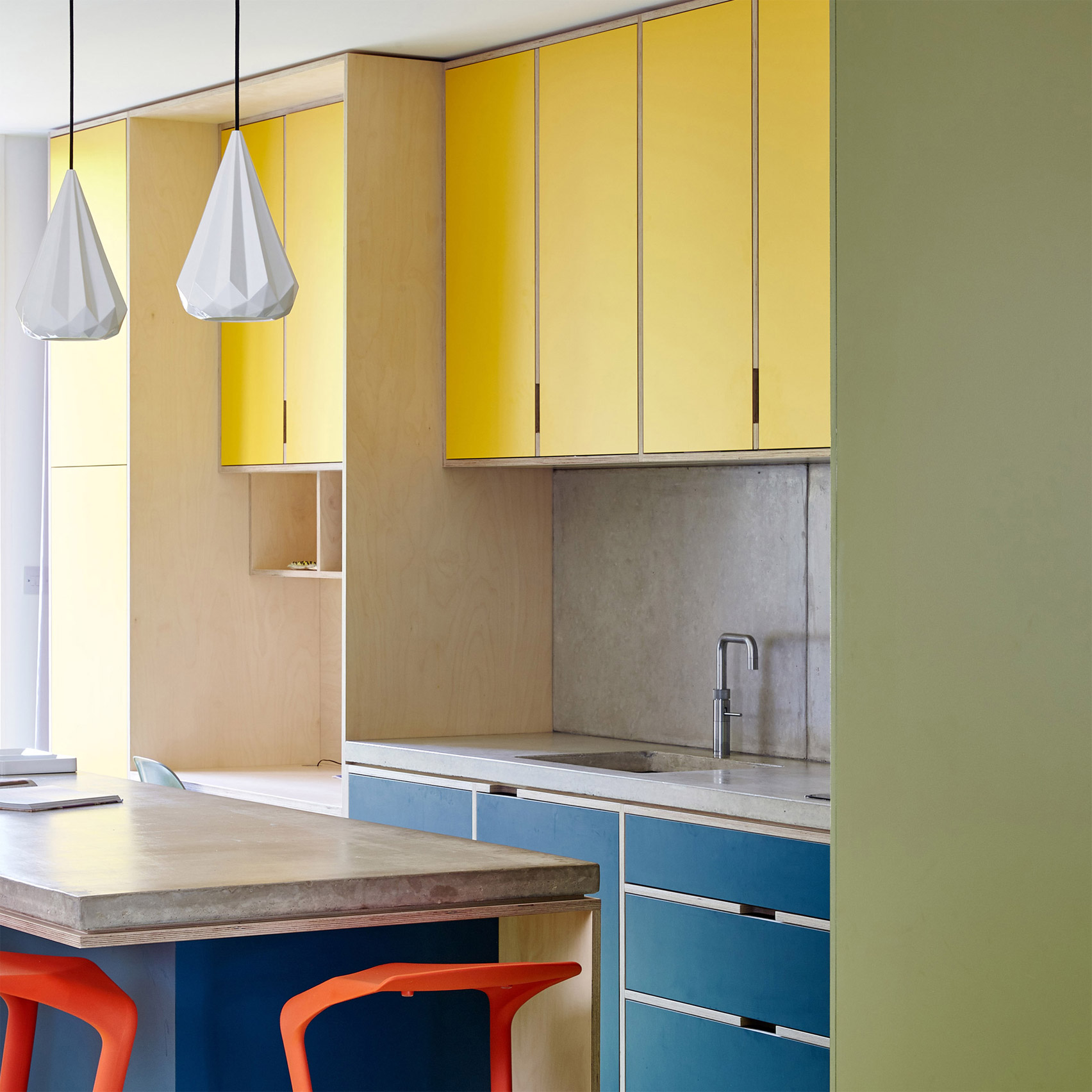 Multi-coloured kitchen with concrete countertops