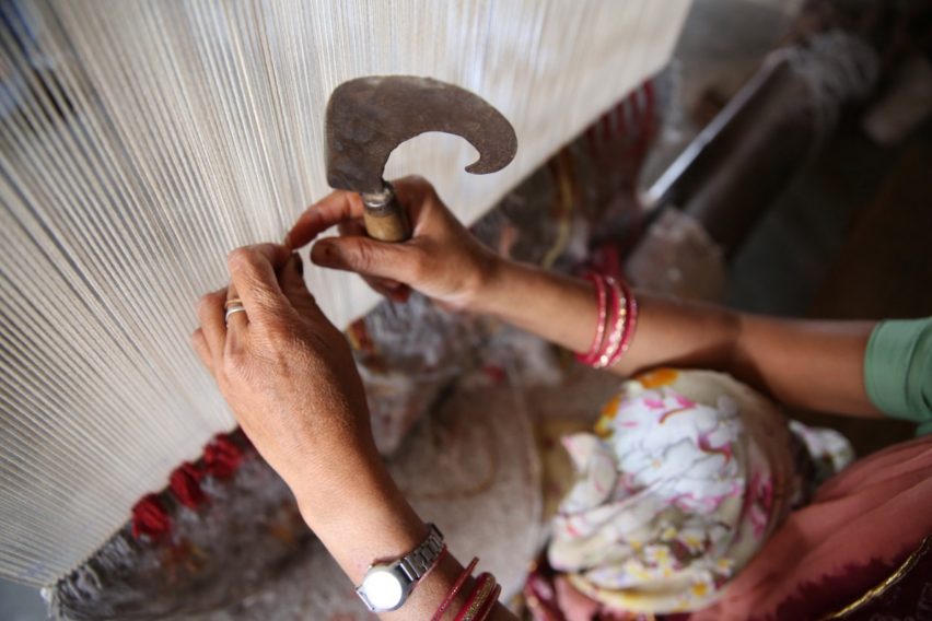 Deepak being hand-knotted in the Jaipur Rugs factory