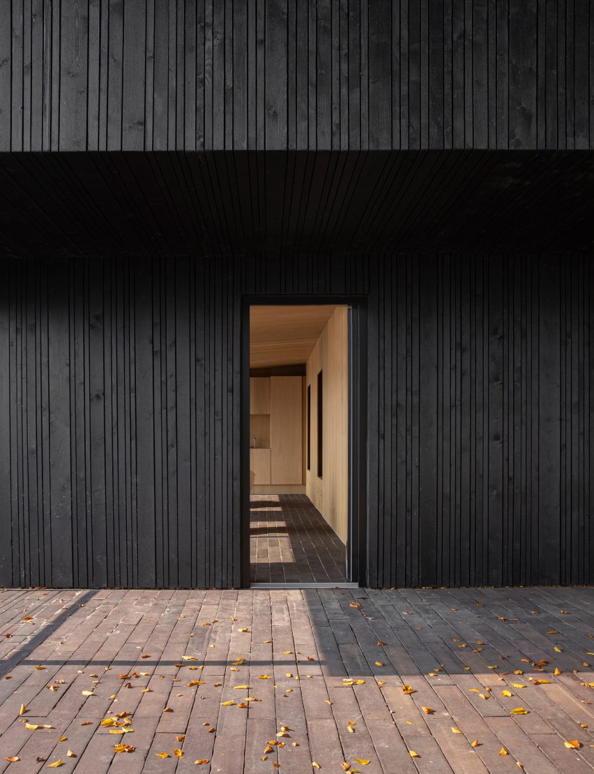 Fjord Boat House by Norm Architects features black-timber facade