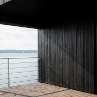 Fjord Boat House by Norm Architects features black-timber facade