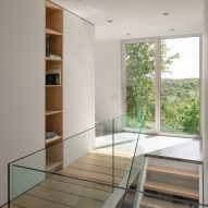 Staircase and catwalk in Bedroom in Forest House I by Natalie Dionne Architecture