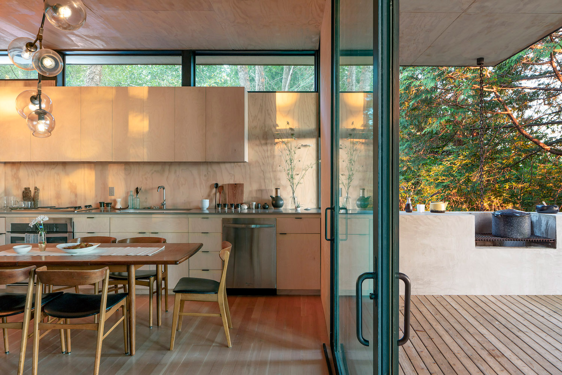 Kitchen with pass-through window onto outdoor grill deck
