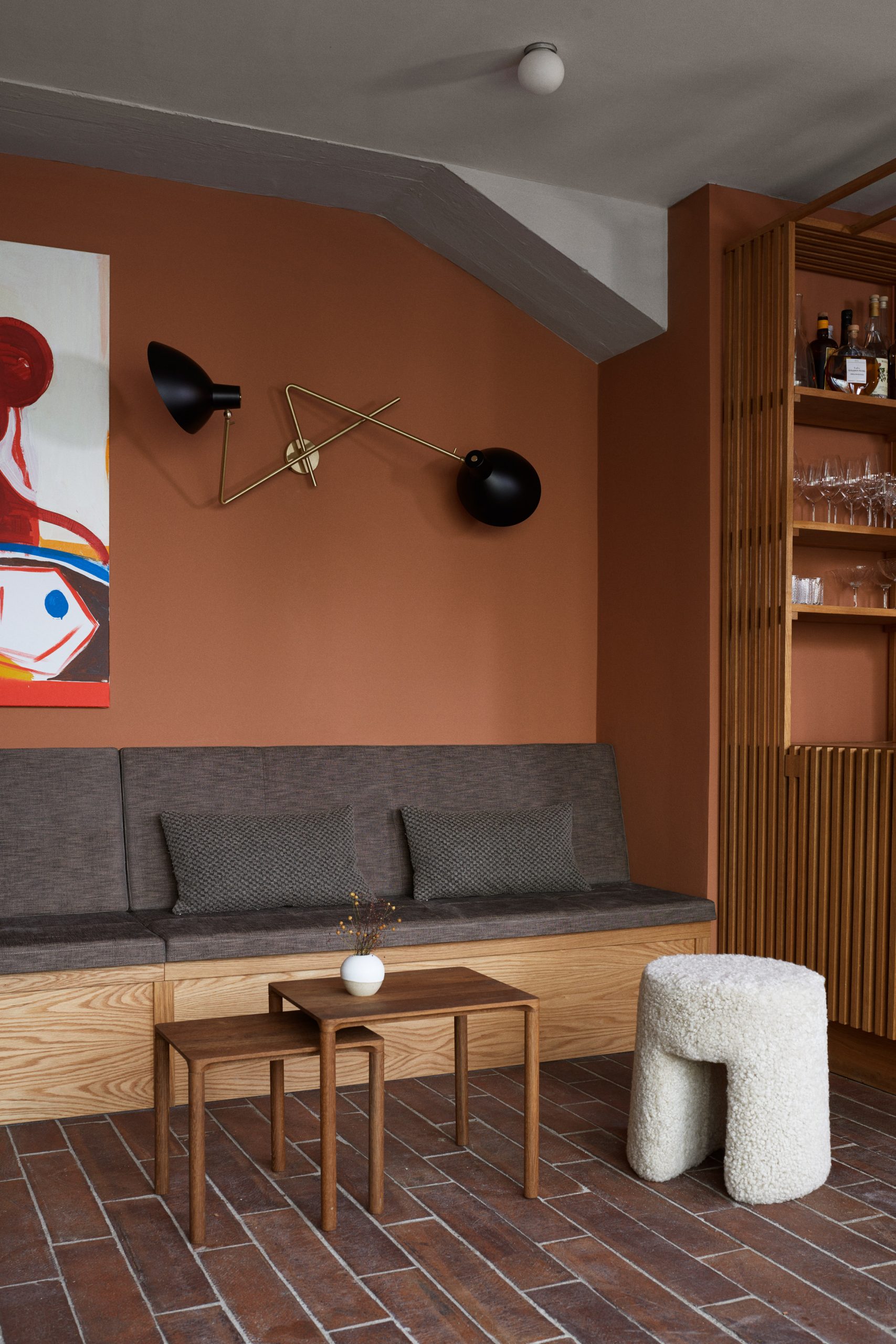 Terracotta-coloured lounge in Kadeau Copenhagen by OEO Studio