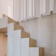 Stairs leading to mezzanine of of Project #13 by Studio Wills + Architects
