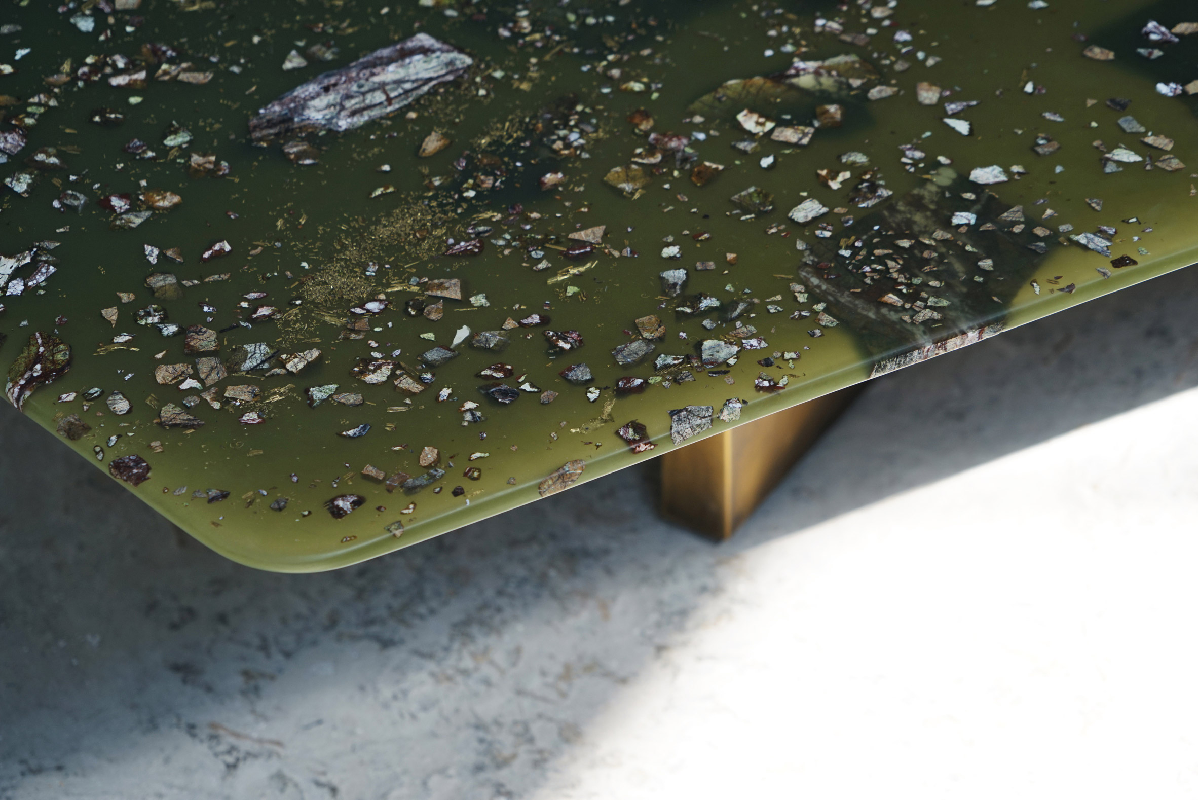 T Sakhi's Reconciled Fragments tables are made using resin, brass powder and marble