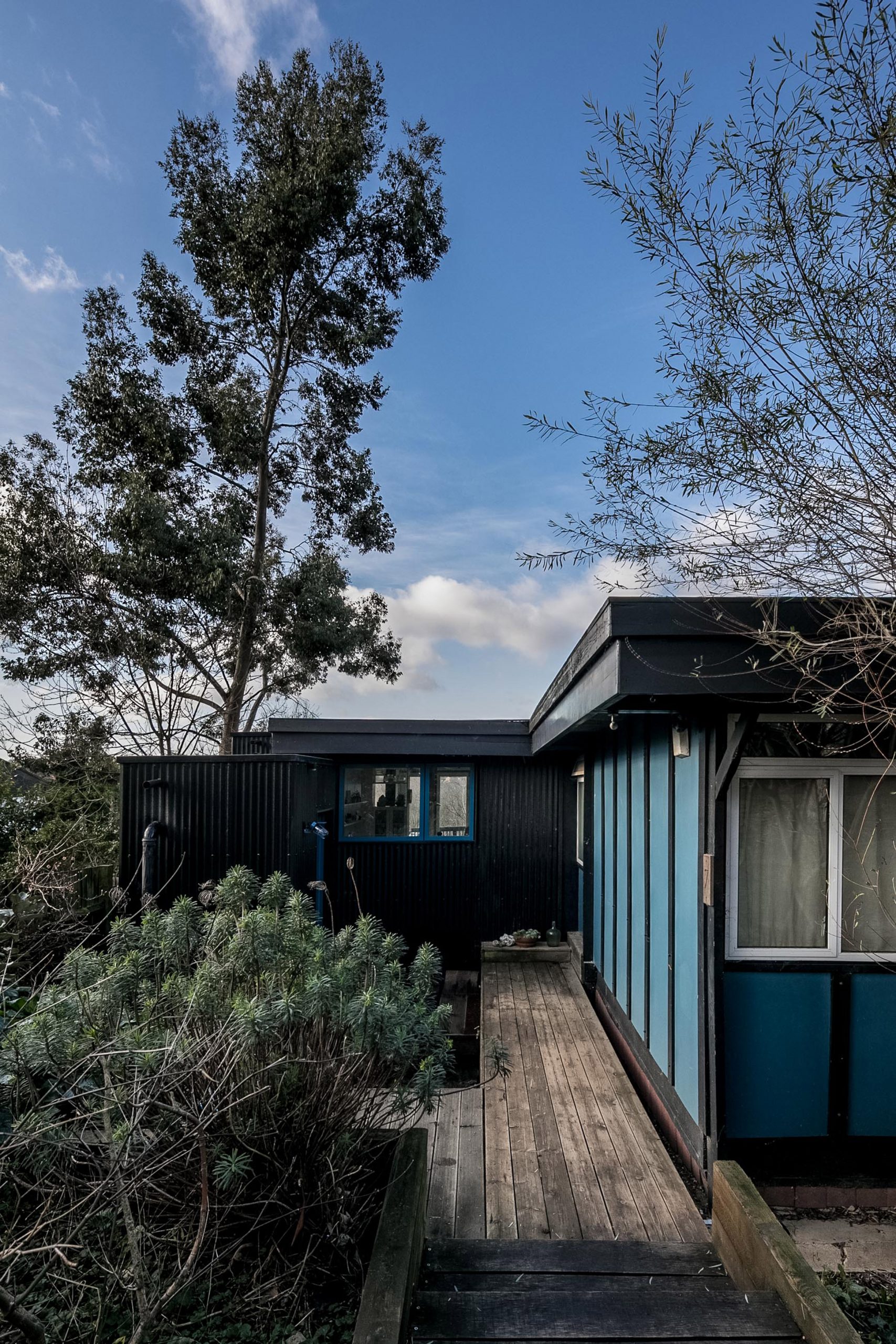 Profiled metal sheet cladding on extension