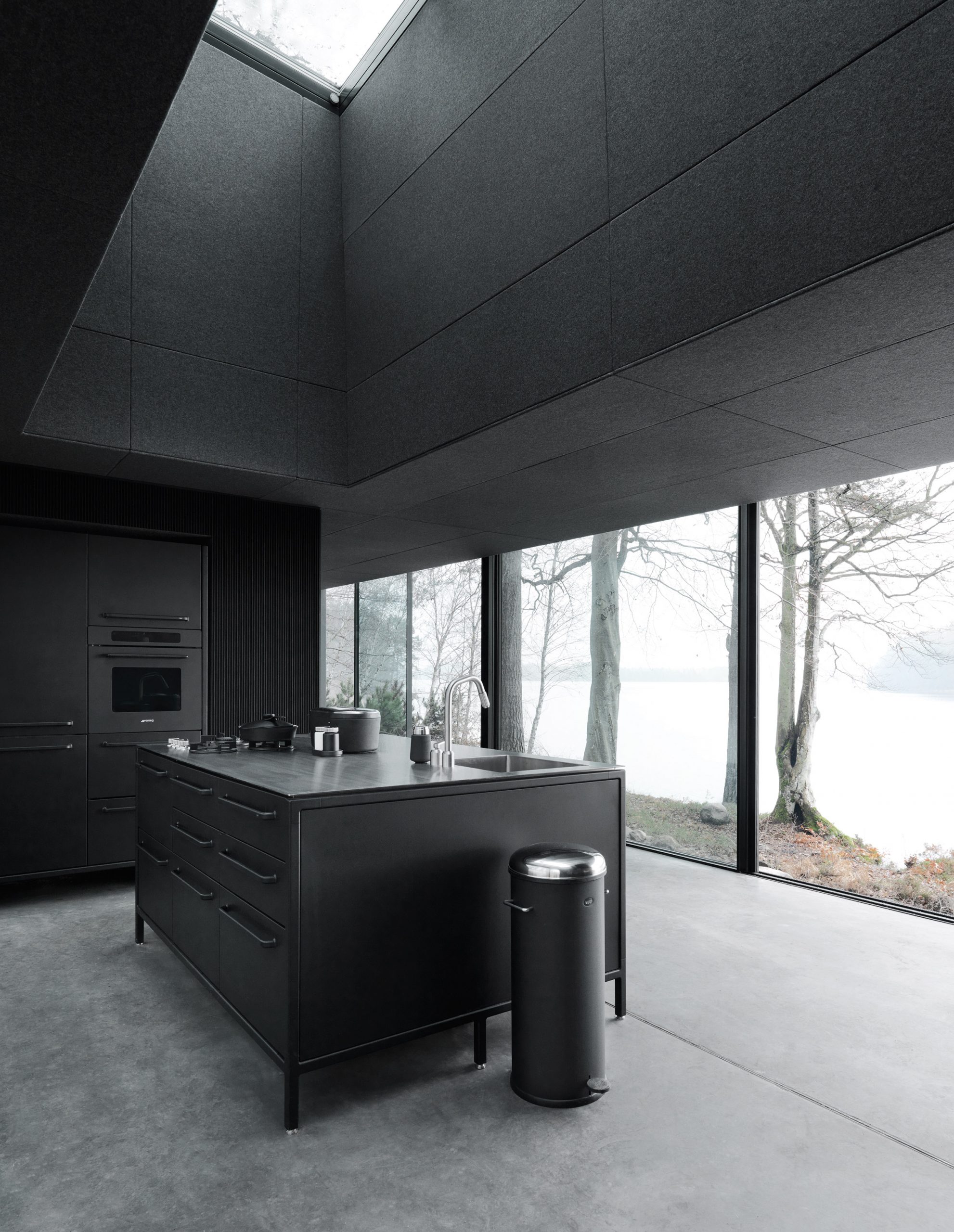 All-black kitchen in a prefab cabin