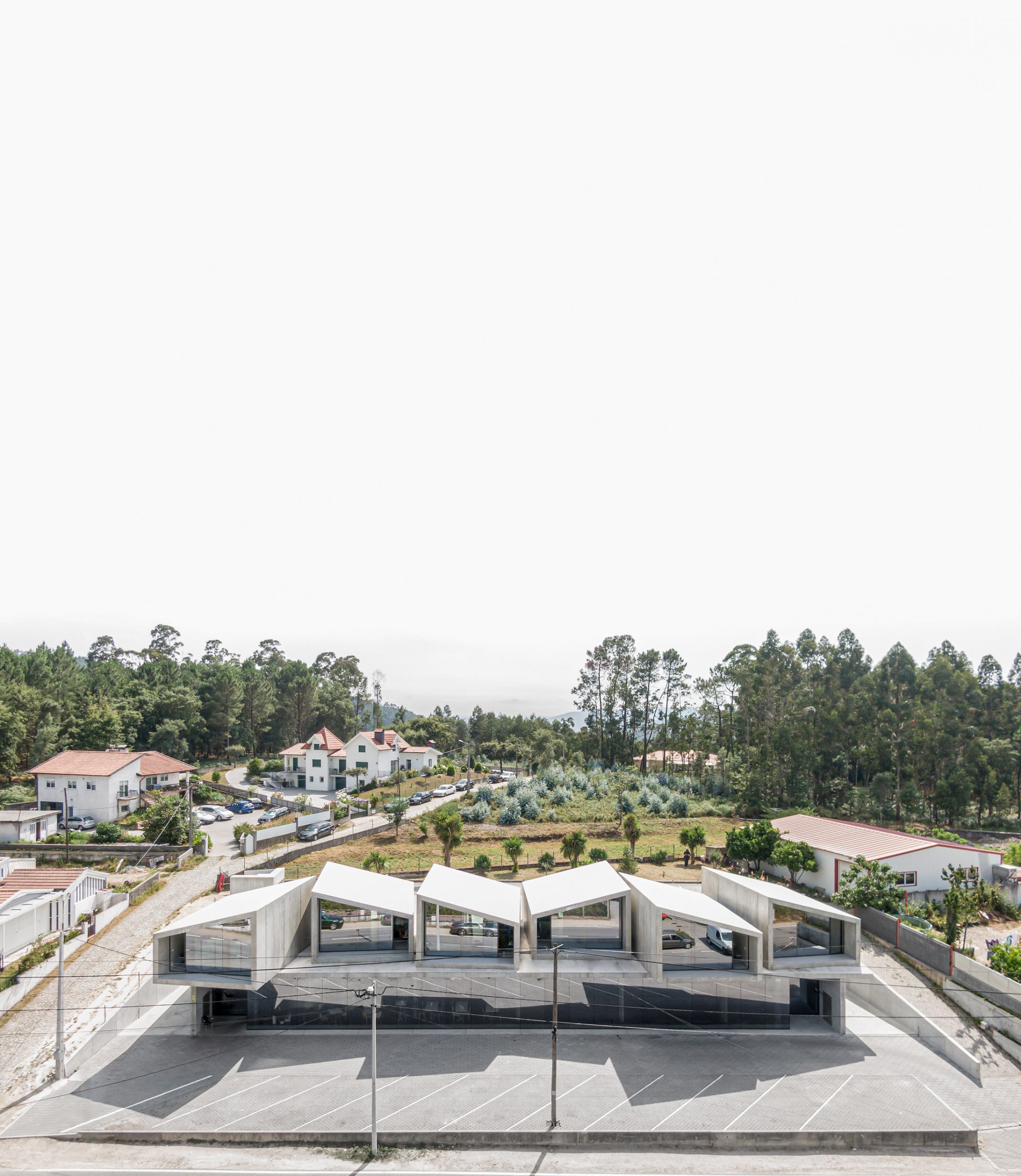 Houses and mixed-use combine to make VDC modular prefabricated concrete housing by Summary in Portugal
