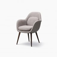 A Swoon lounge chair with wooden legs by Space Copenhagen for Fredericia