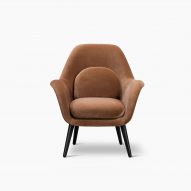 A Swoon lounge chair with wooden legs by Space Copenhagen for Fredericia