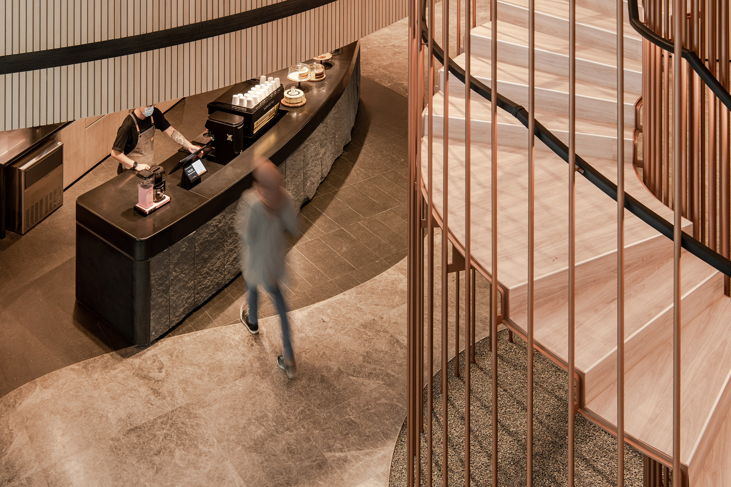The cafe and staircase by Ministry of Design inside YTL Headquarters in Kuala Lumpur