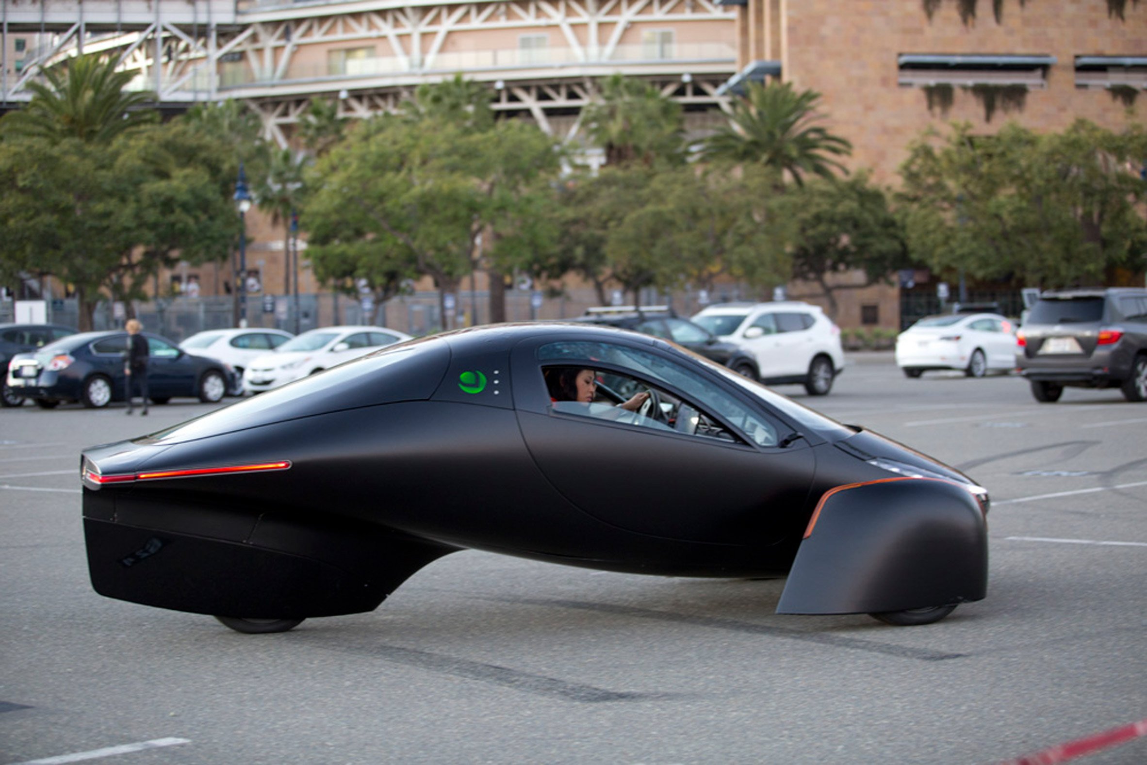 Side view of the three-wheeled solar and electric Aptera vehicle