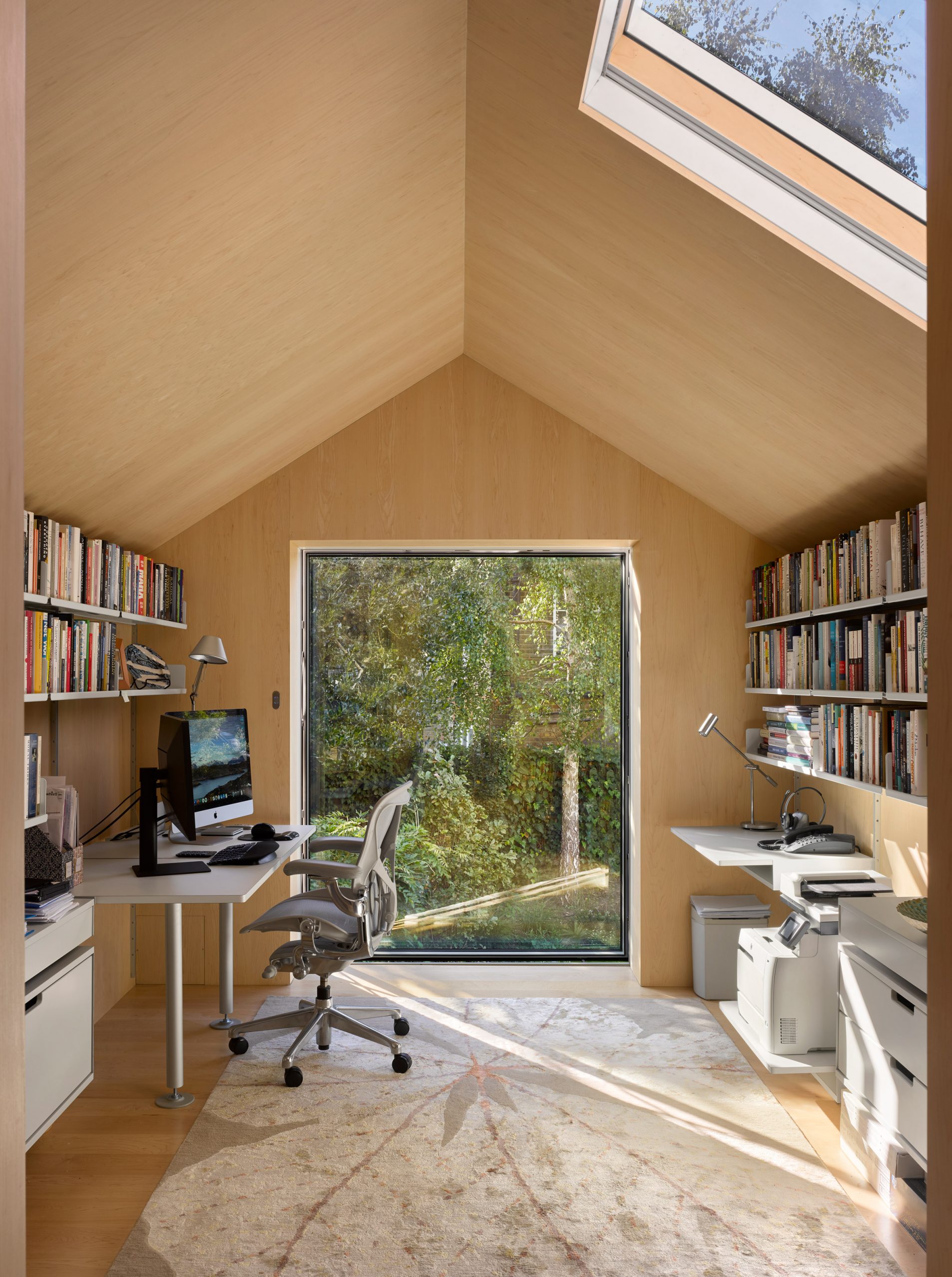 View through window of first-floor office in Hampstead House by Dominic McKenzie Architects