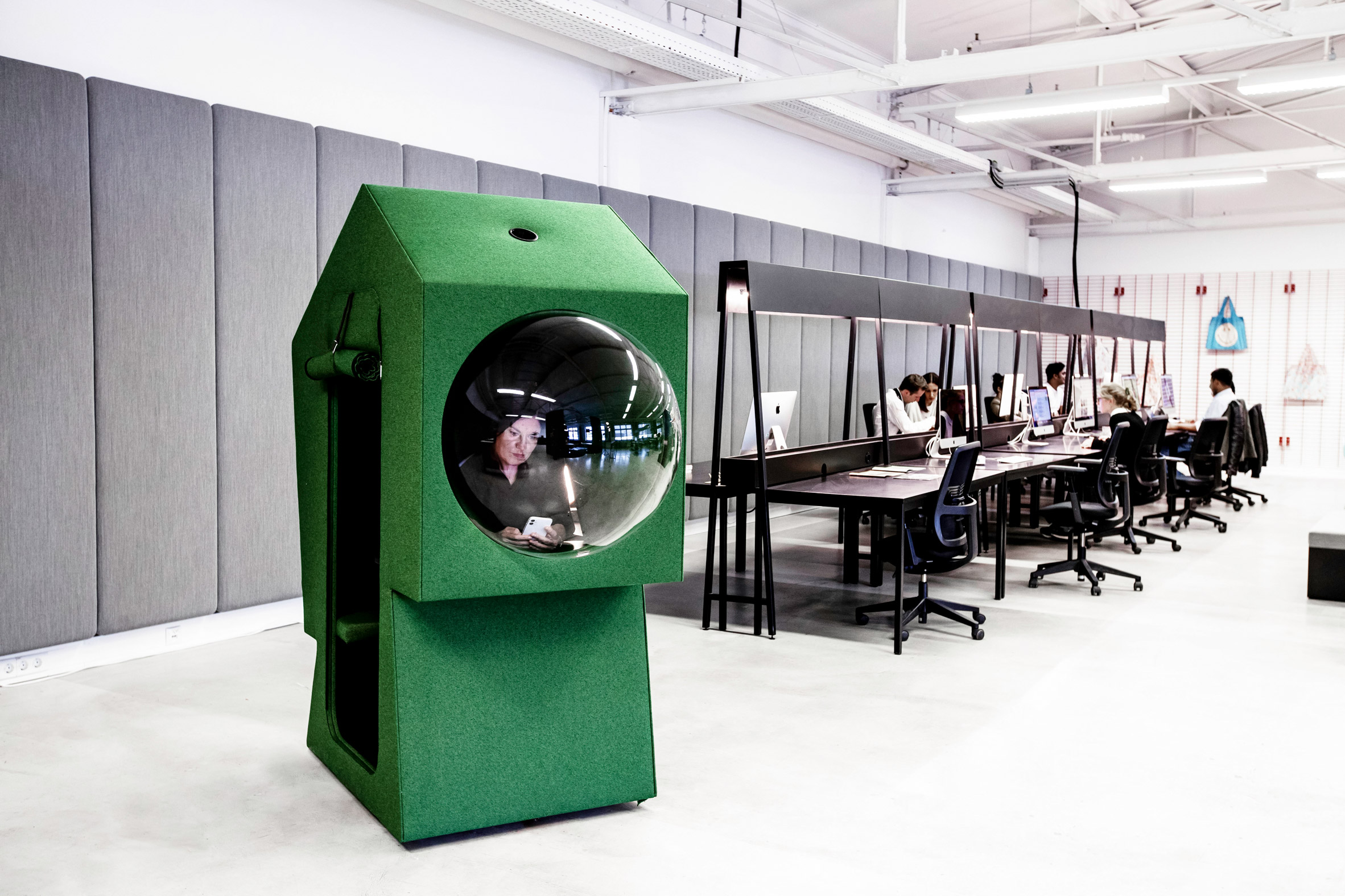 Green work capsule in LOQI Activity Office by Studio Aisslinger