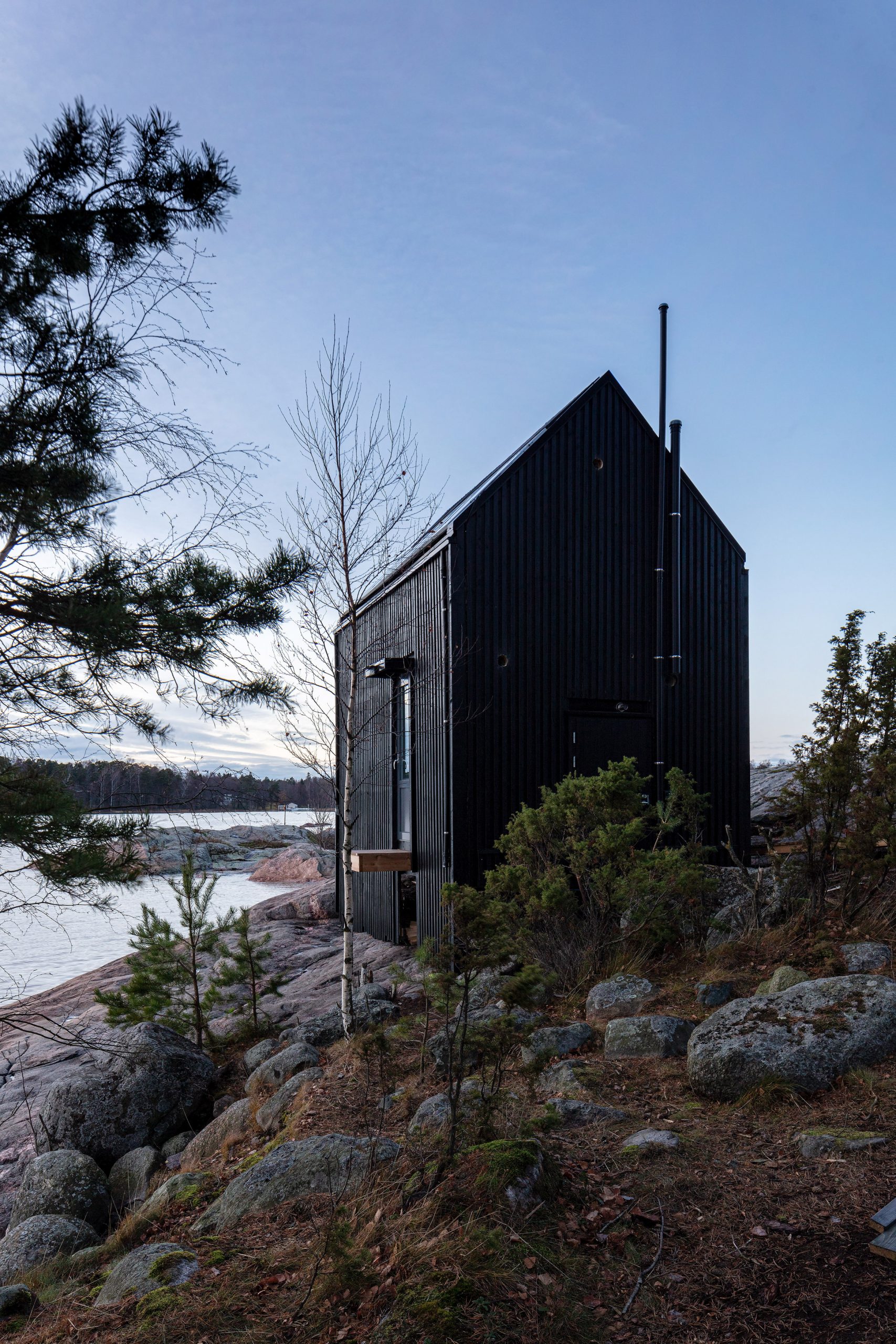 Exterior view of Majamaja, and off-grid cabin by Pekka Littow